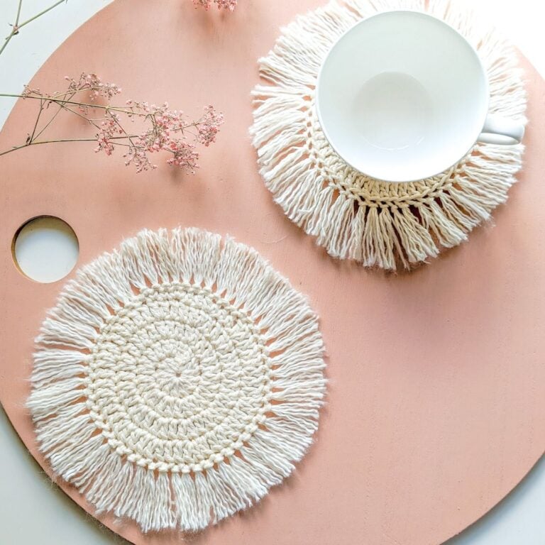 A crochet circle coaster and a crochet spiral coaster.