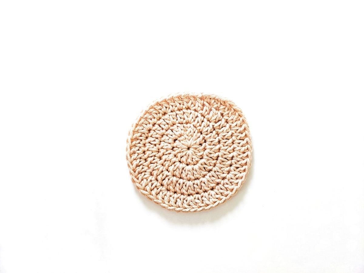a flat crochet circle made with cotton yarn