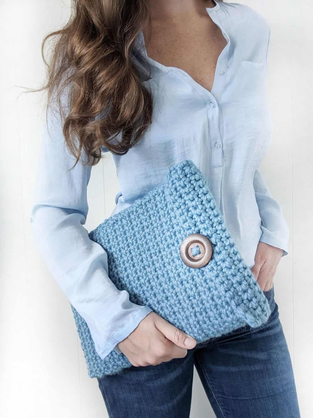 a double-thick laptop cover that's made with Lion Brand Wool Ease Thick & Quick yarn in the color blue