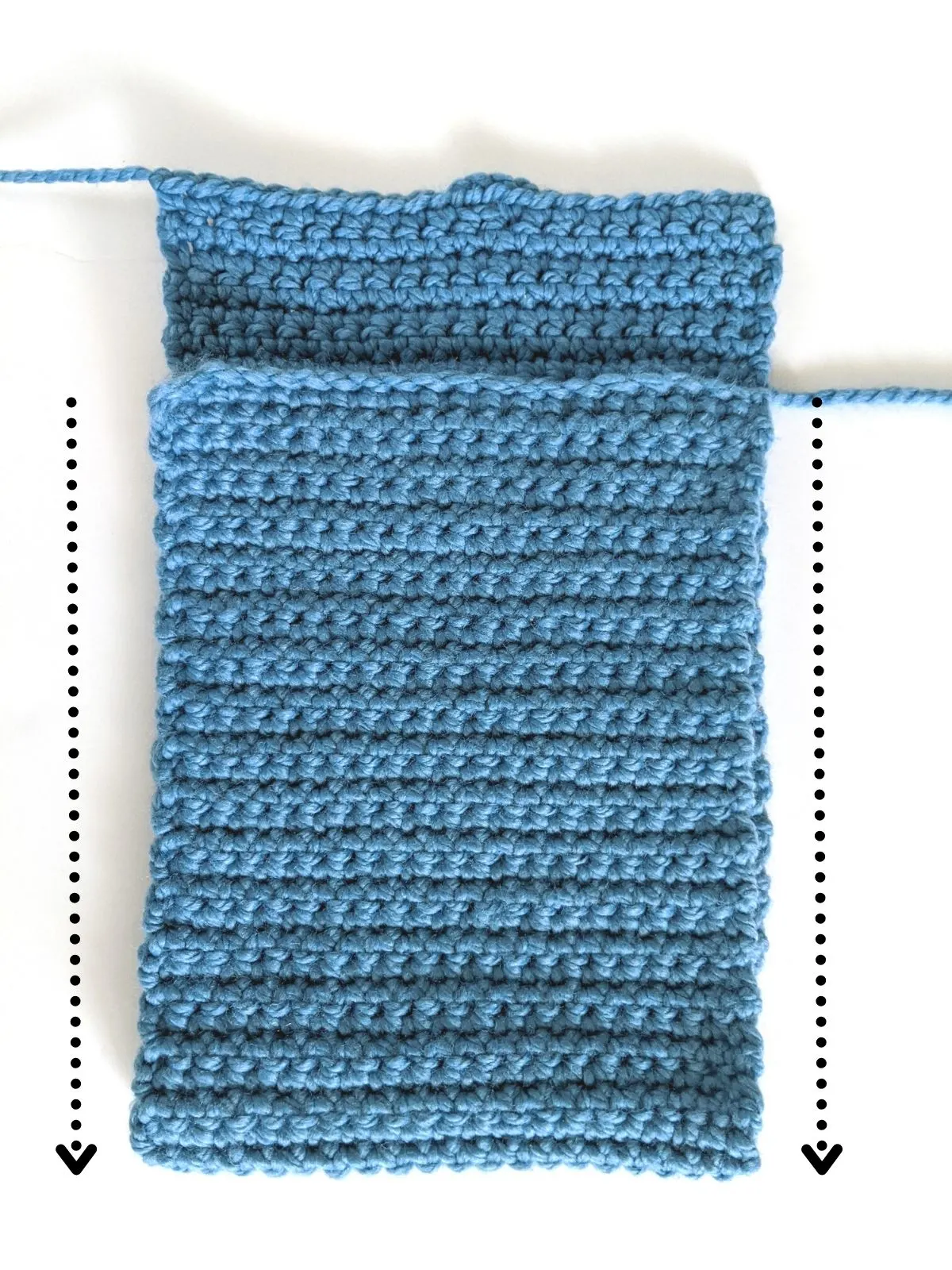 picture shows how to fold over your crochet rectangle to create a laptop cover