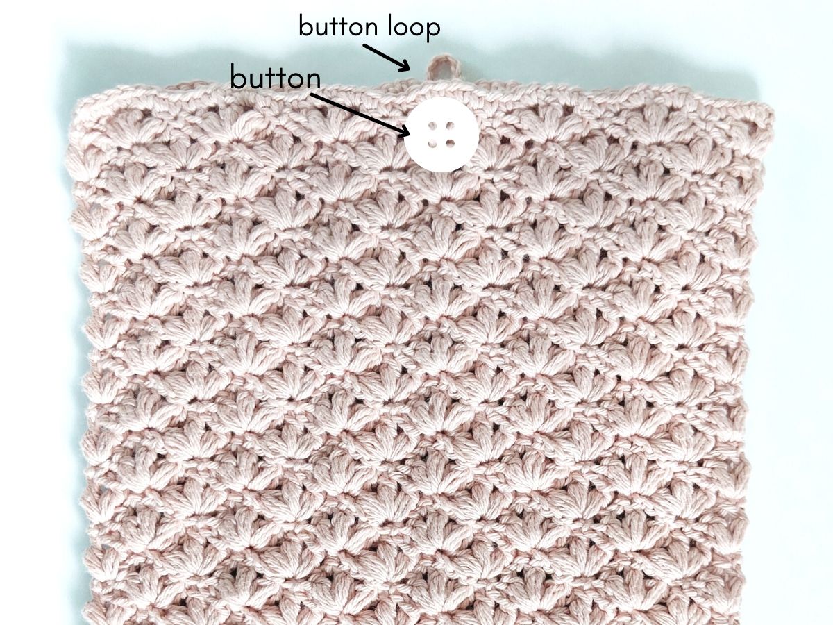 how to sew a button onto your crochet laptop cover
