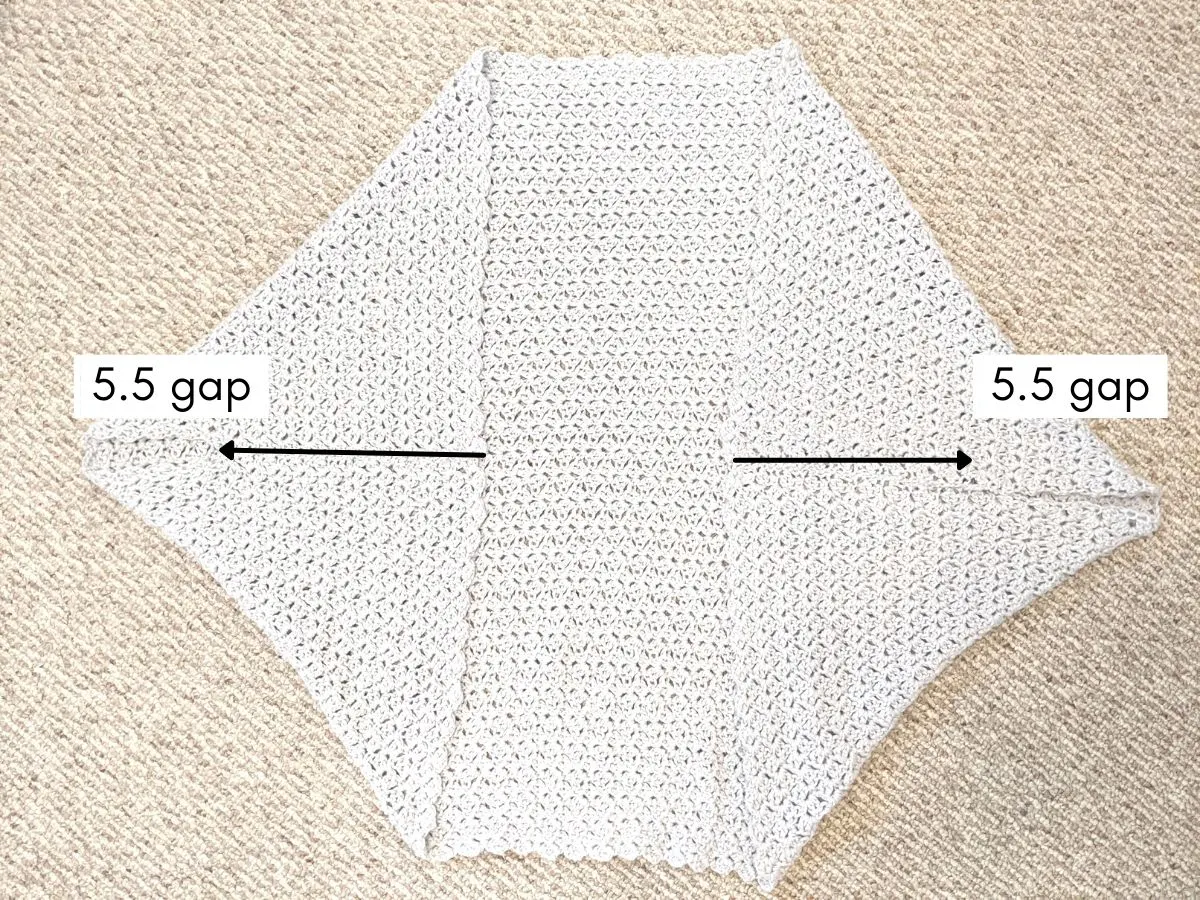 fold both sides of the panel to create a crochet shrug