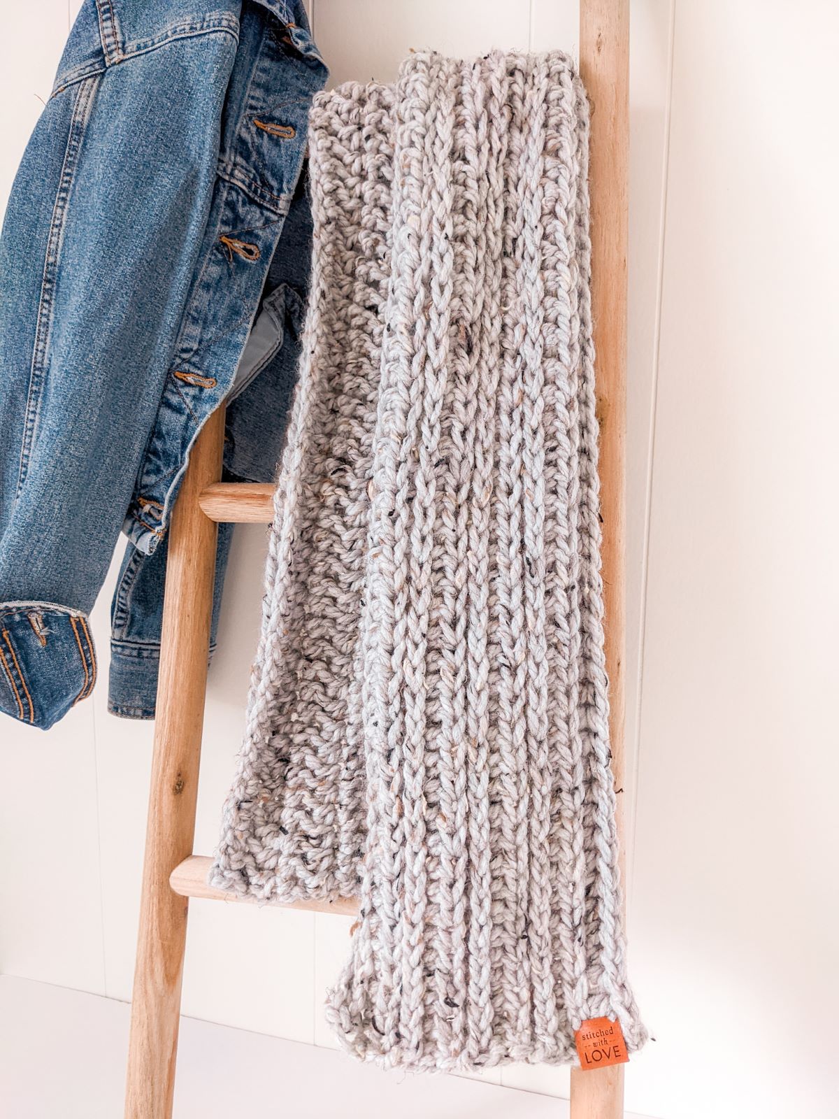 A bulky weight crochet scarf in the color grey.
