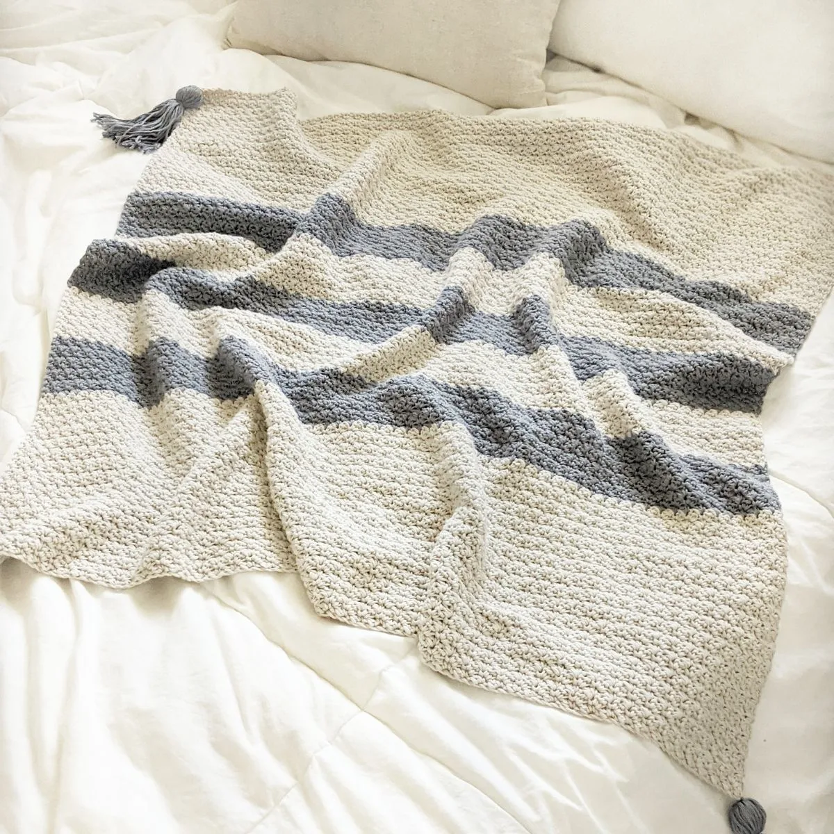 modern striped crochet baby blanket using the suzette stitch