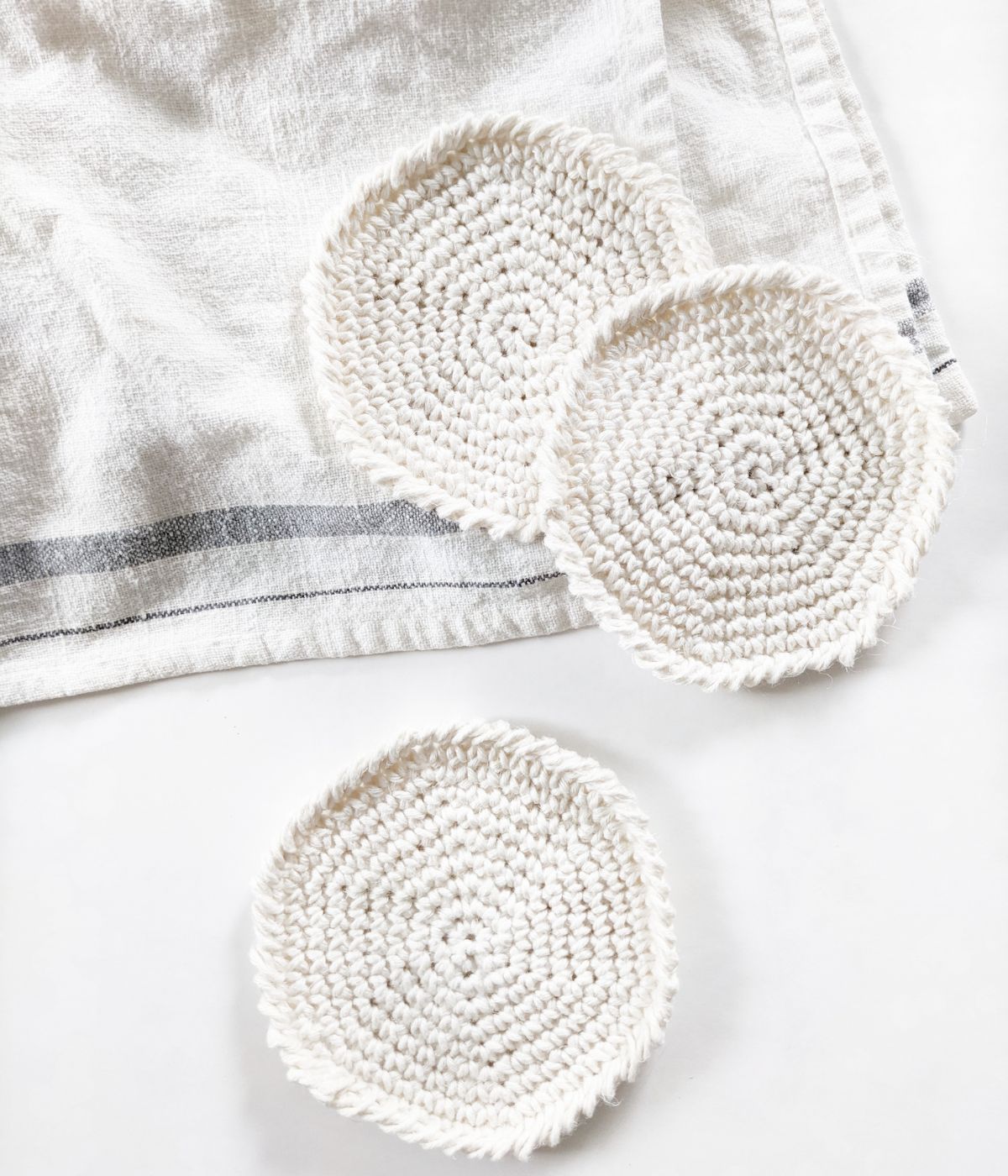 crochet flat circle coaster made using single crochet stitches 