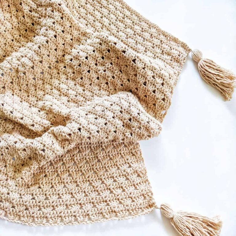 A free crochet shell stitch baby blanket pattern made with Lion Brand Coboo yarn