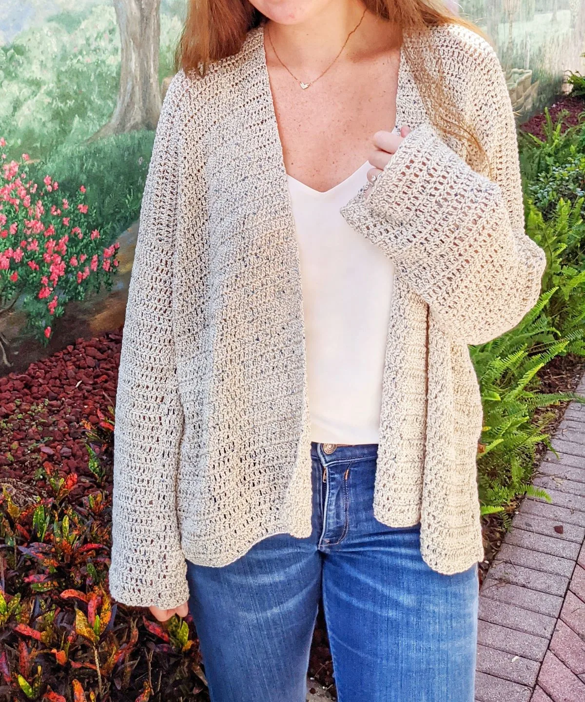 model is showing a front view of the beginner oversized crochet cardigan pattern