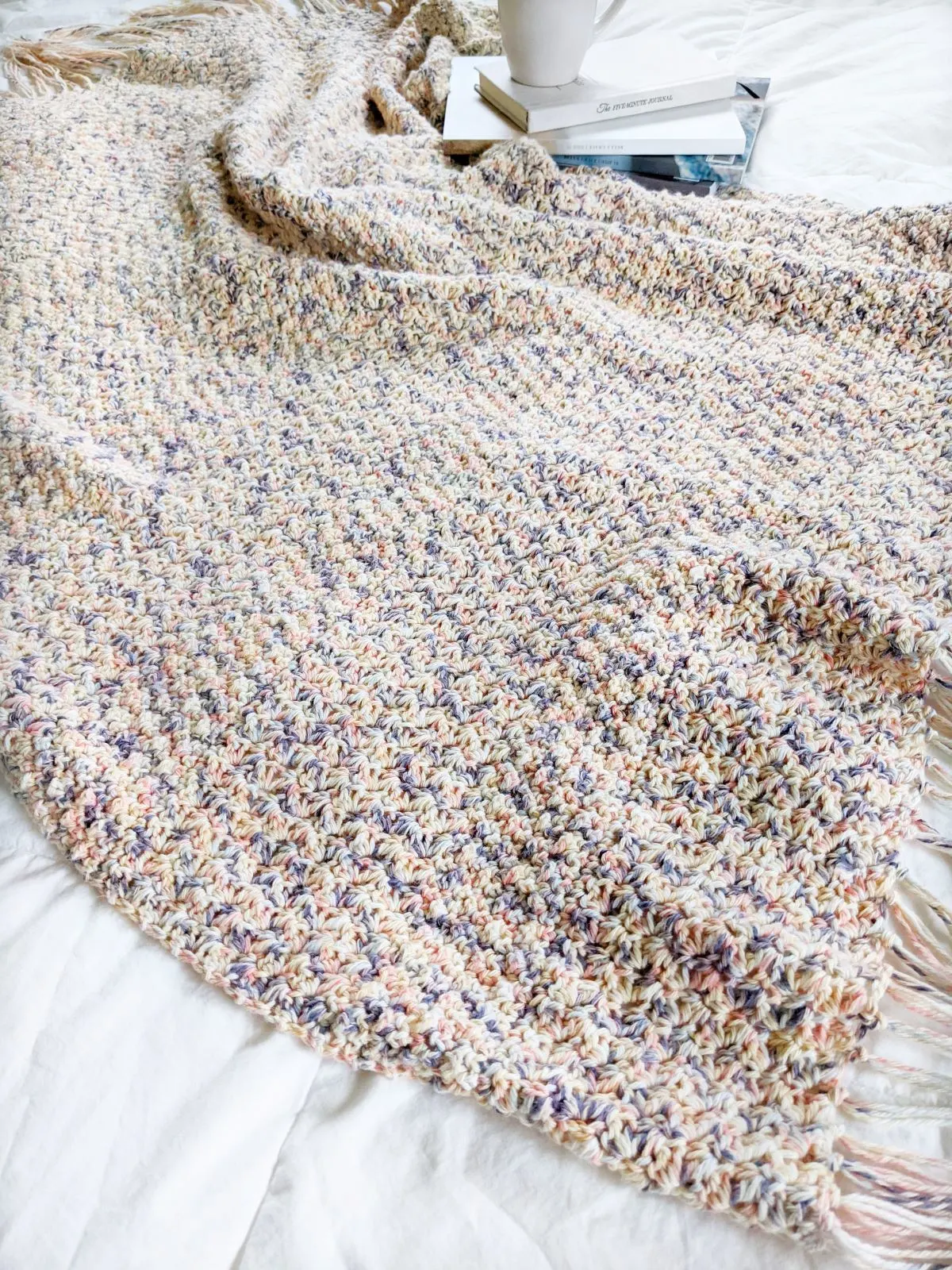 a beginner crochet blanket that is made with cotton yarn