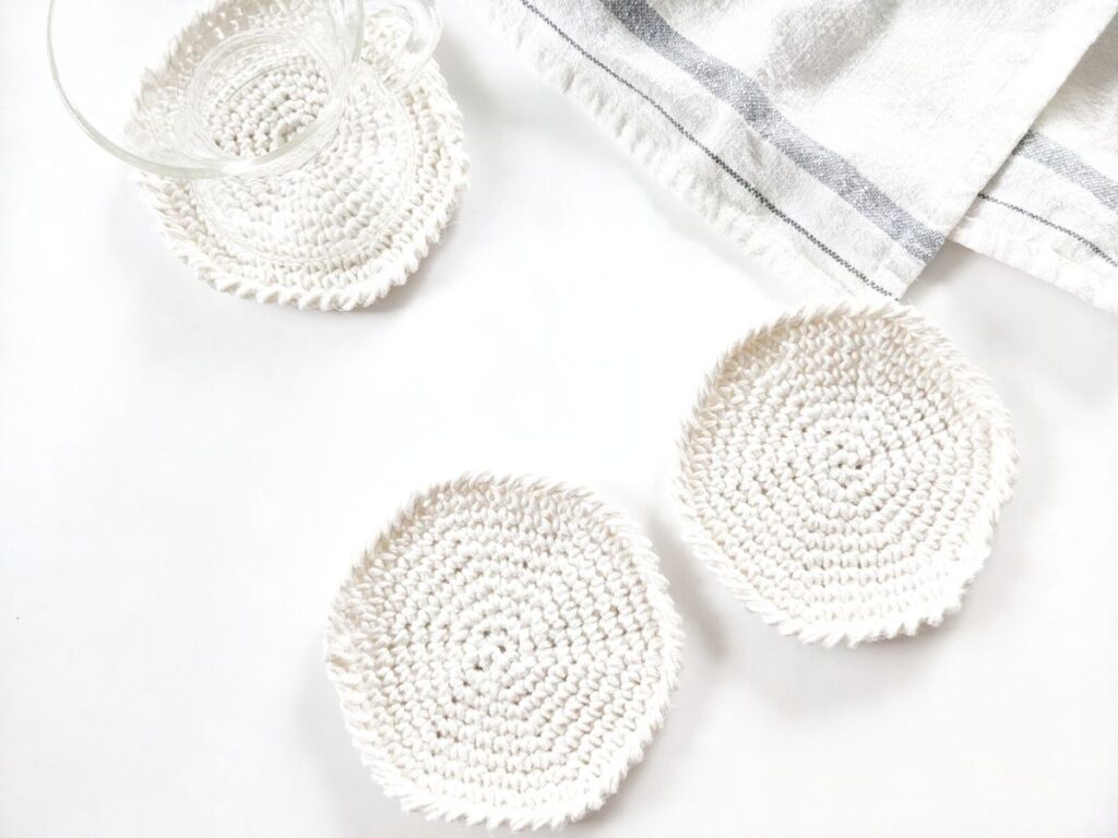 a basic round crochet coaster pattern that is made from cotton yarn. 