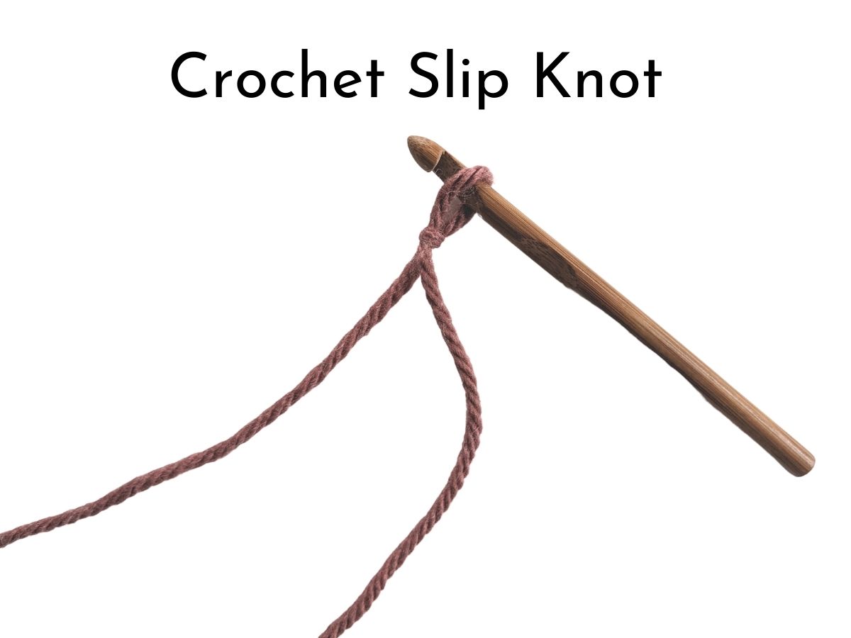 Image shows a bulky weight yarn wrapped around a wooden crochet hook. 