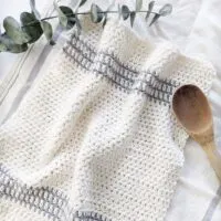 A handmade striped crochet kitchen towel