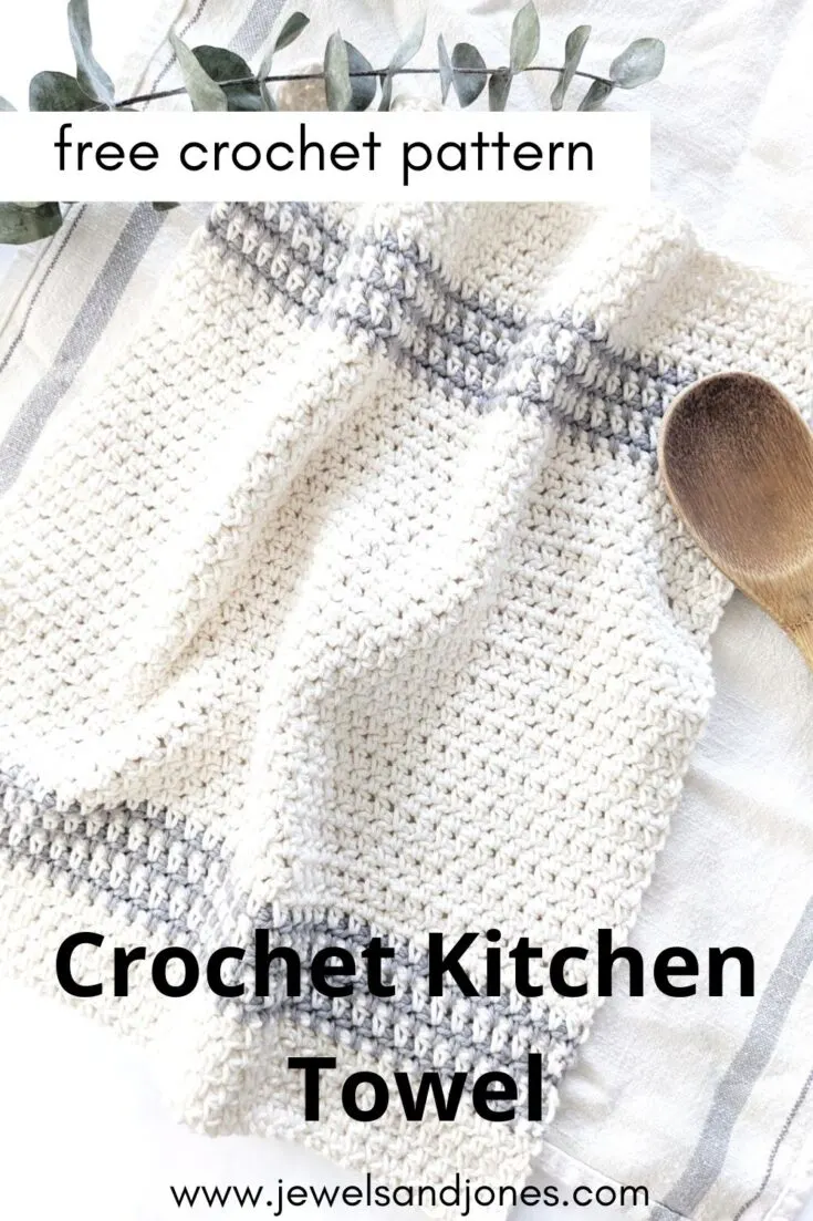 Image shows a kitchen towel with stripes and wooden spoon.