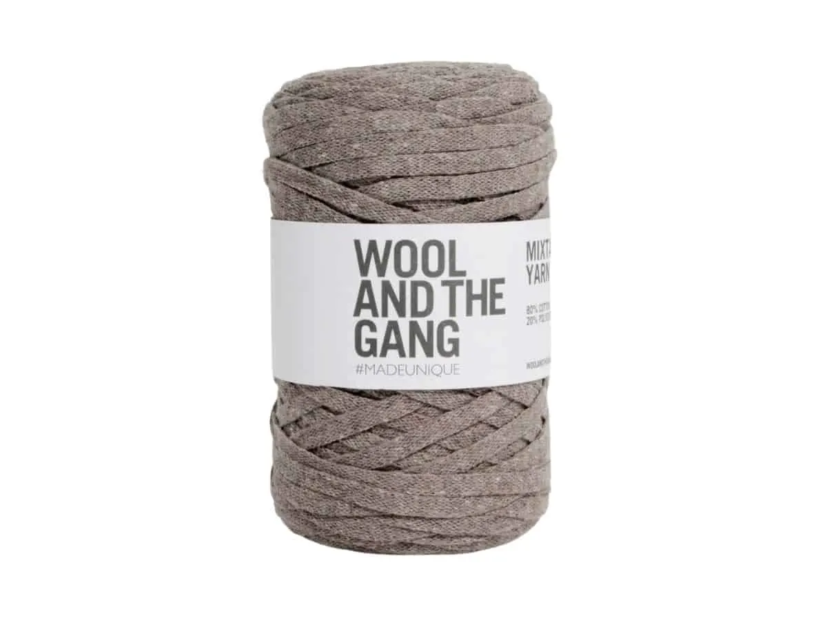 A brown ball of Wool and the Gang Mix Tape Yarn.