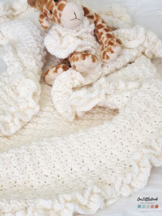 A ruffled crochet baby blanket.