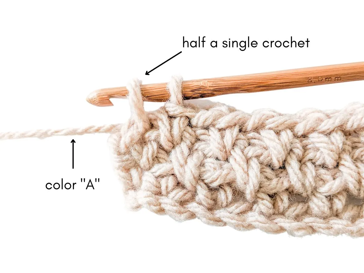 Image shows step 1 on how to change yarn colors in crochet.