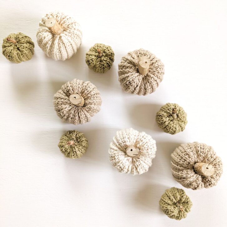 An assortment of different sized crochet pumpkins.