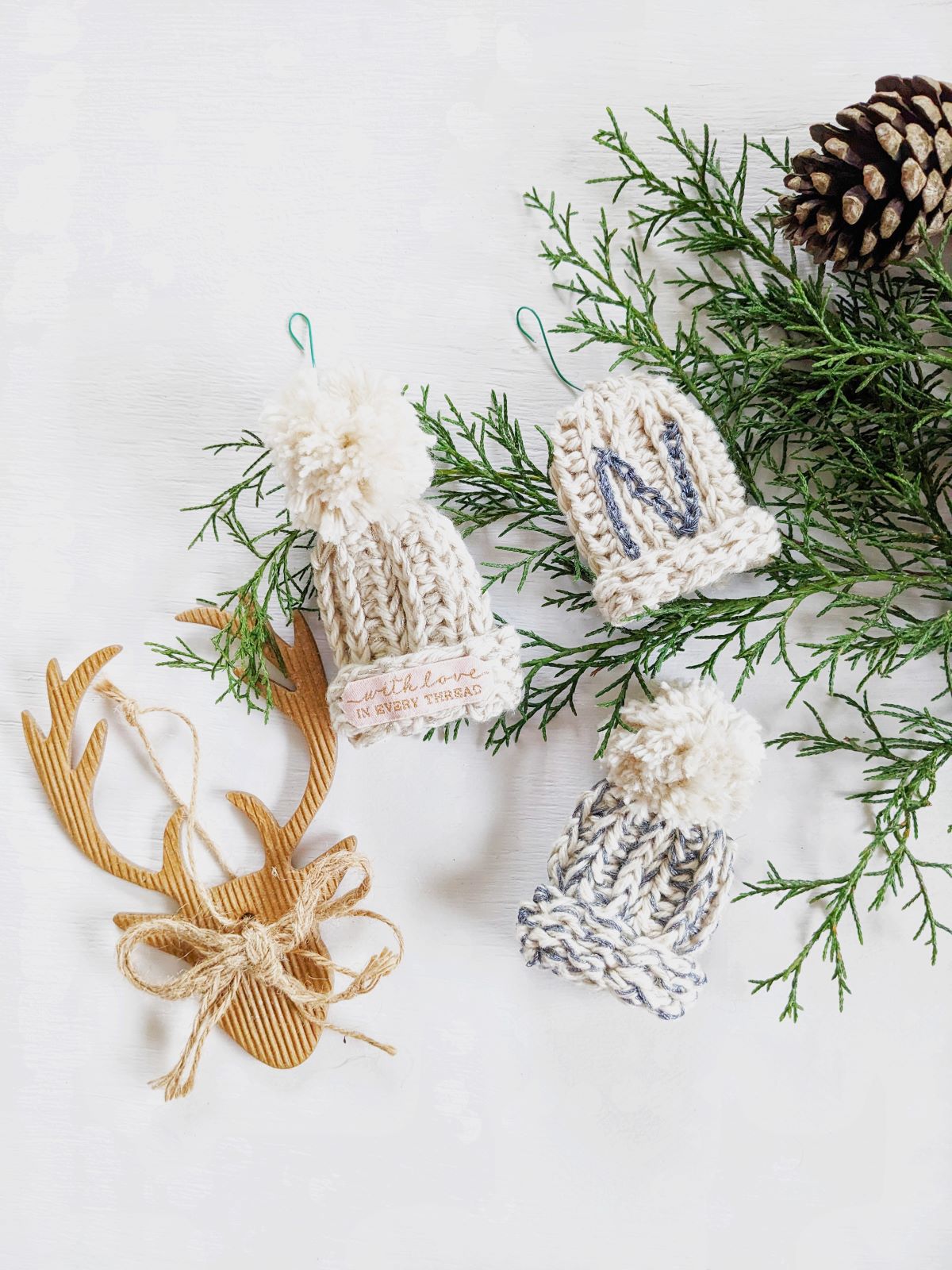 A mini crochet beanie ornament made with two colors.