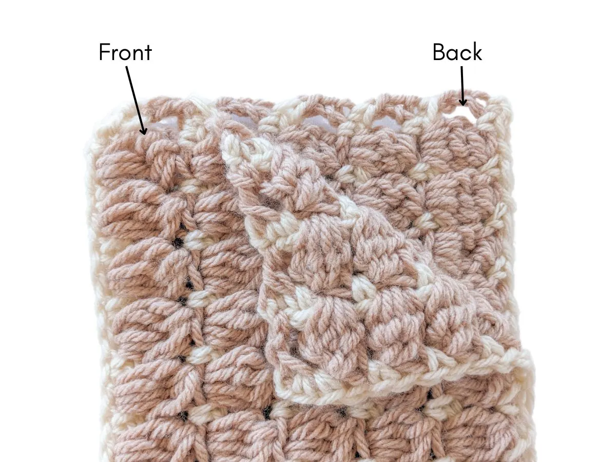 The front and back side of a scarf. 