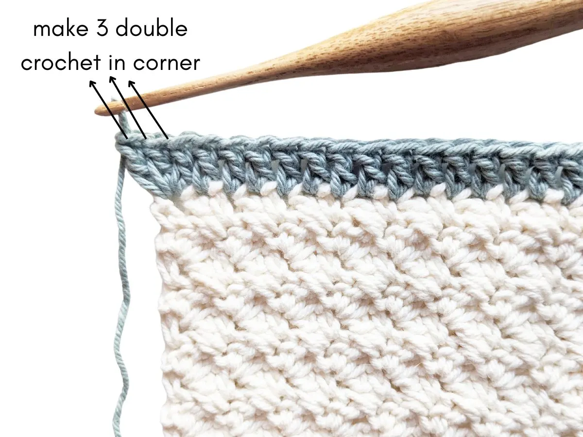 Three double crochets in a double crochet corner for border.