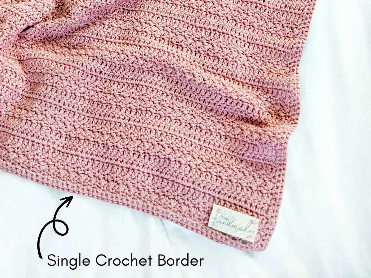 A single crochet border on a crochet baby blanket. 