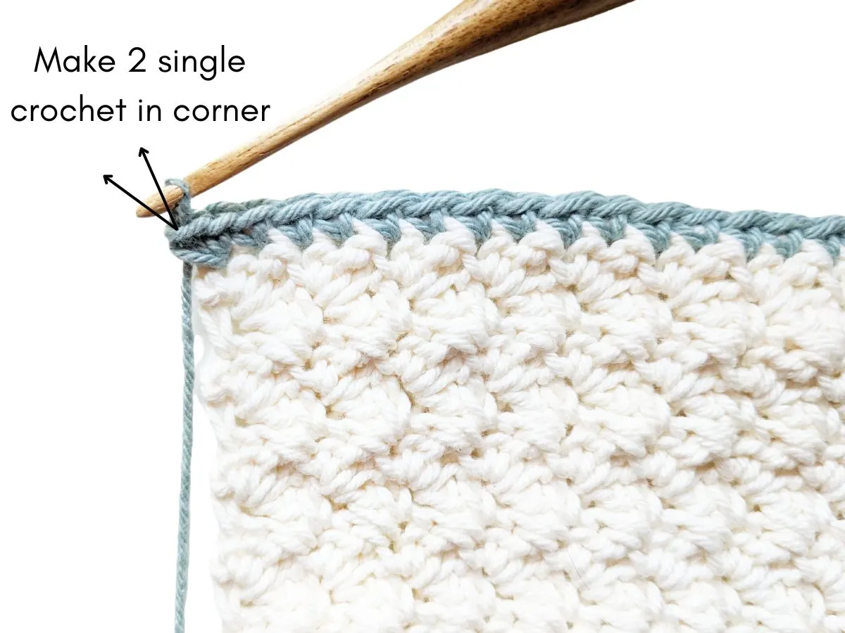 Adding two single crochets in the corner for your border.
