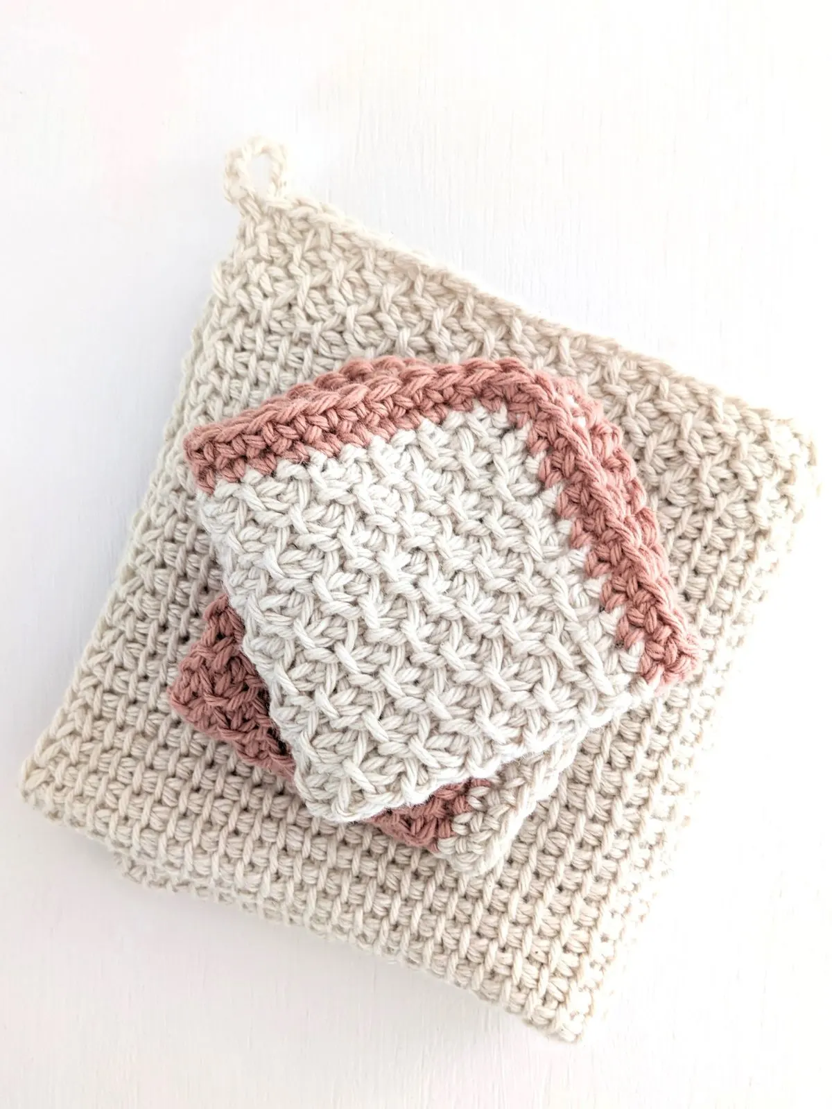 A Tunisian crochet washcloth pattern that uses the honeycomb stitch.