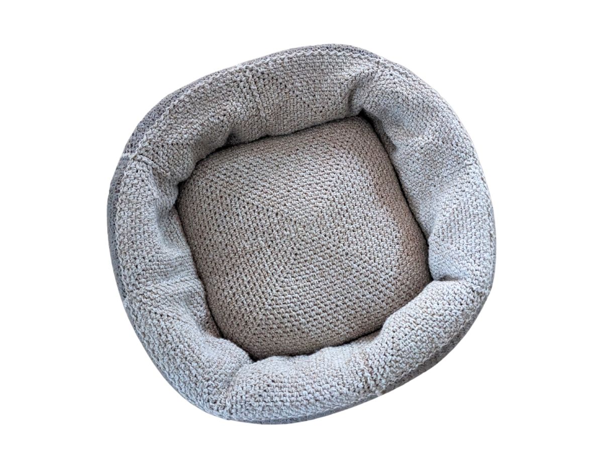 A small to medium size crochet dog bed. 