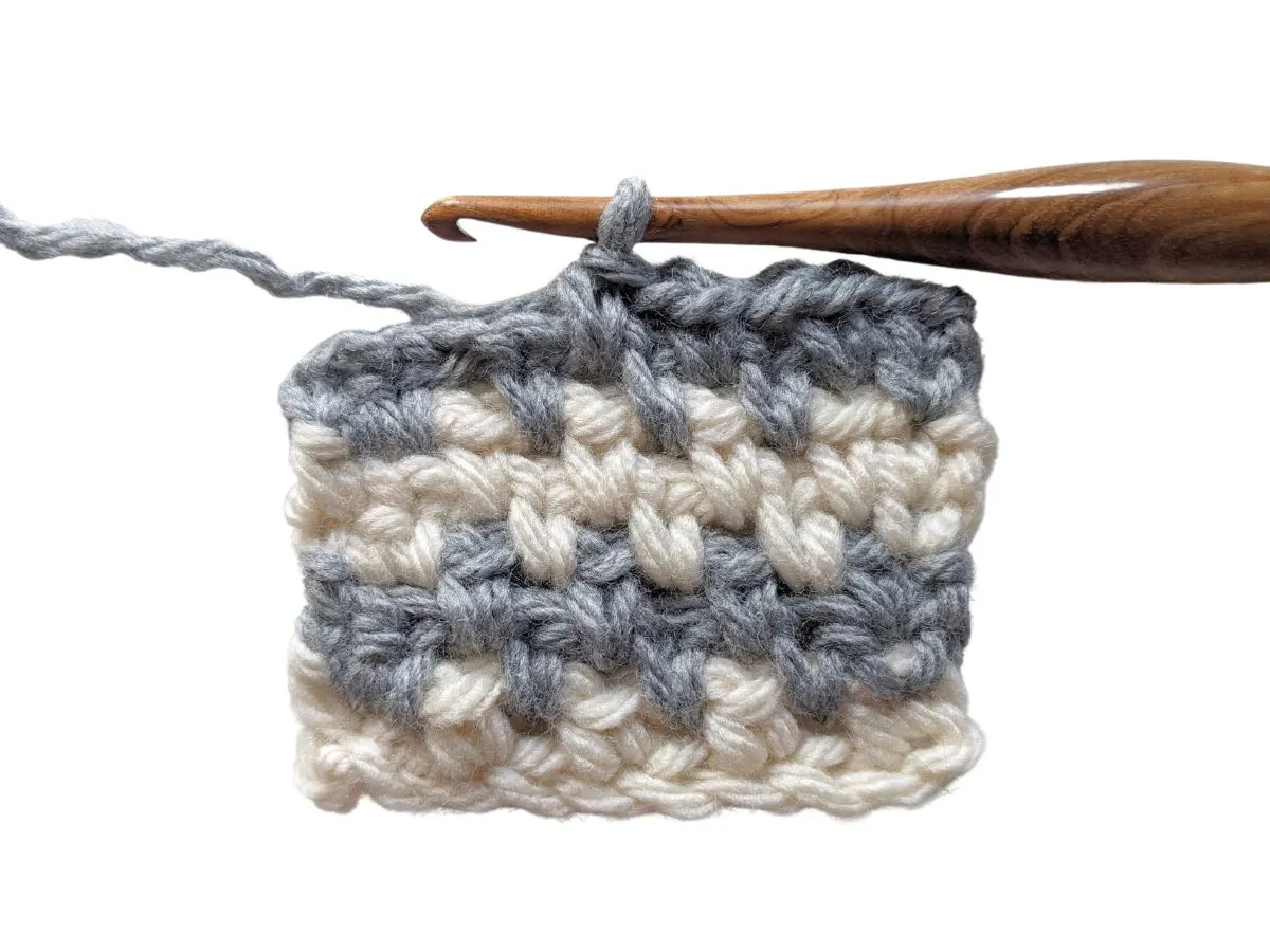 The crochet moss stitch with 2 different colors.