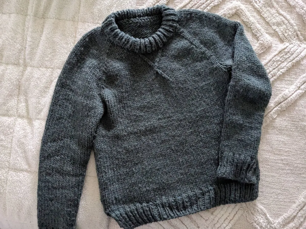 A knitted sweater that's called the Winter League Pullover pattern by Two of Wands.