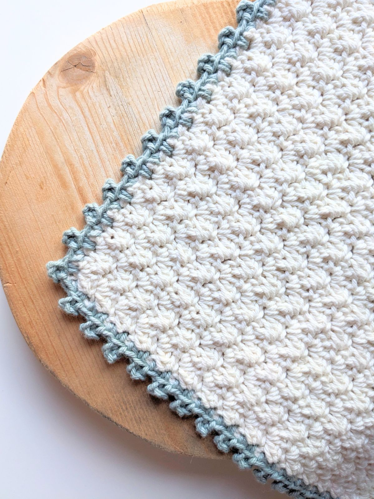 A crochet swatch with a picot stitch border.