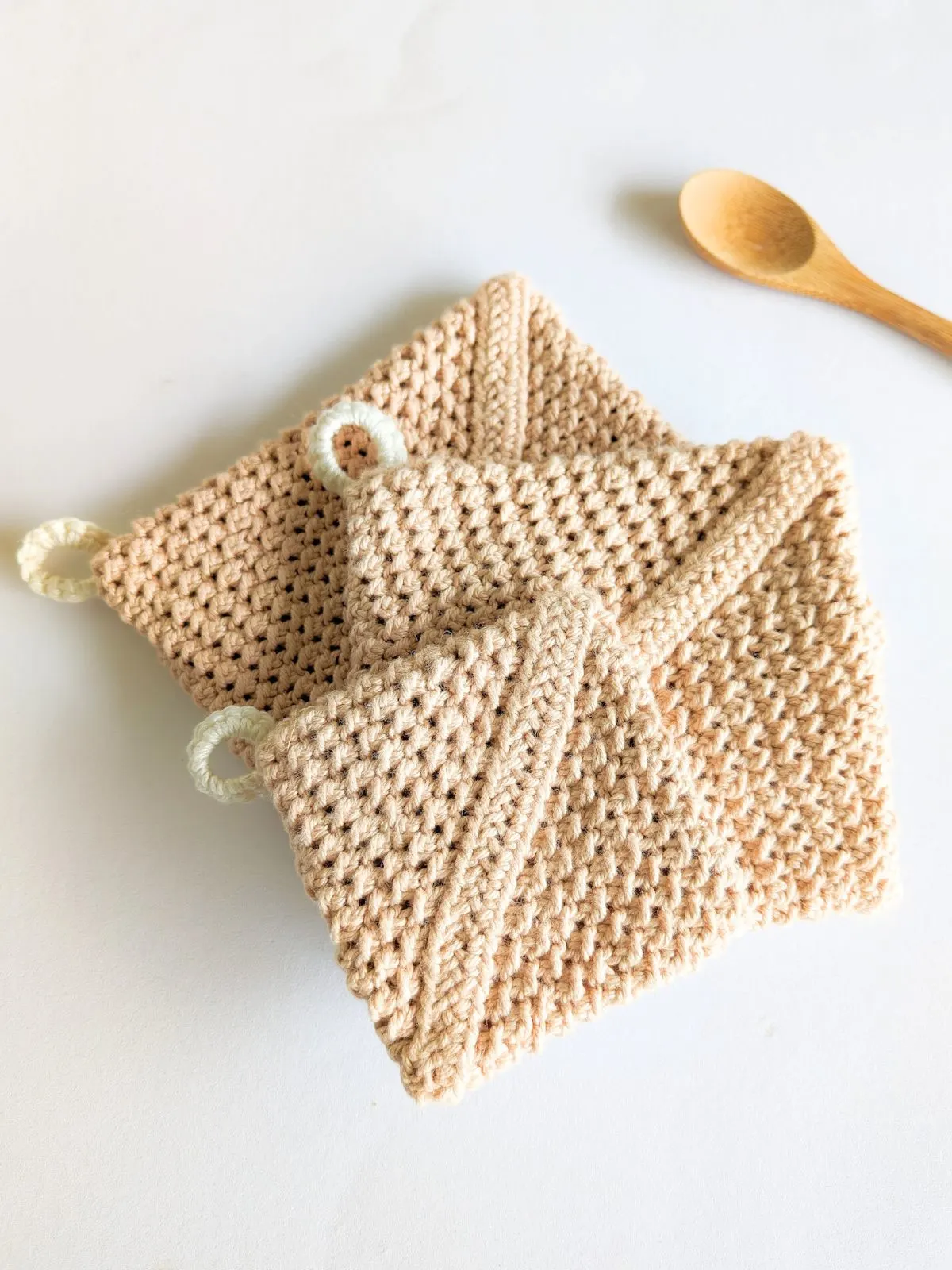 3 crochet potholders in small, medium, and large size.