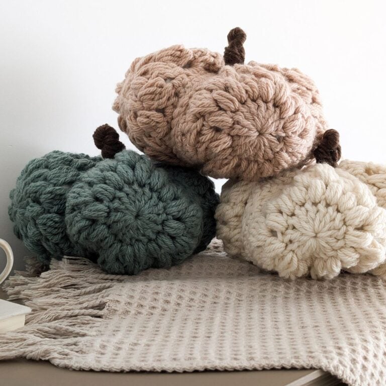 A crochet pumpkin made with granny squares using bulky weight yarn.