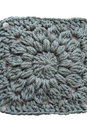 A solid one color starburst granny square that's made from bulky weight yarn.