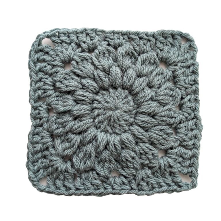 A solid one color starburst granny square that's made from bulky weight yarn.