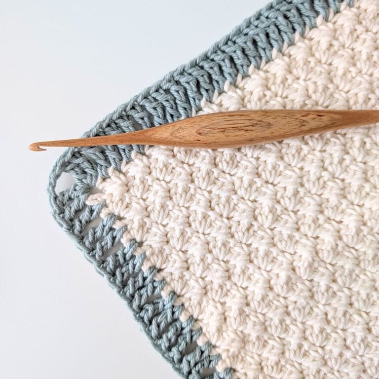 A treble crochet border with a crochet hook.
