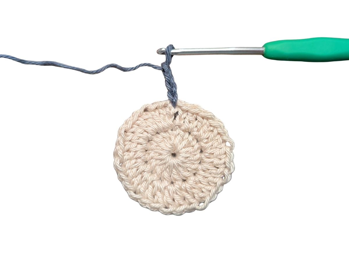 A crochet circle with a double crochet coaster.
