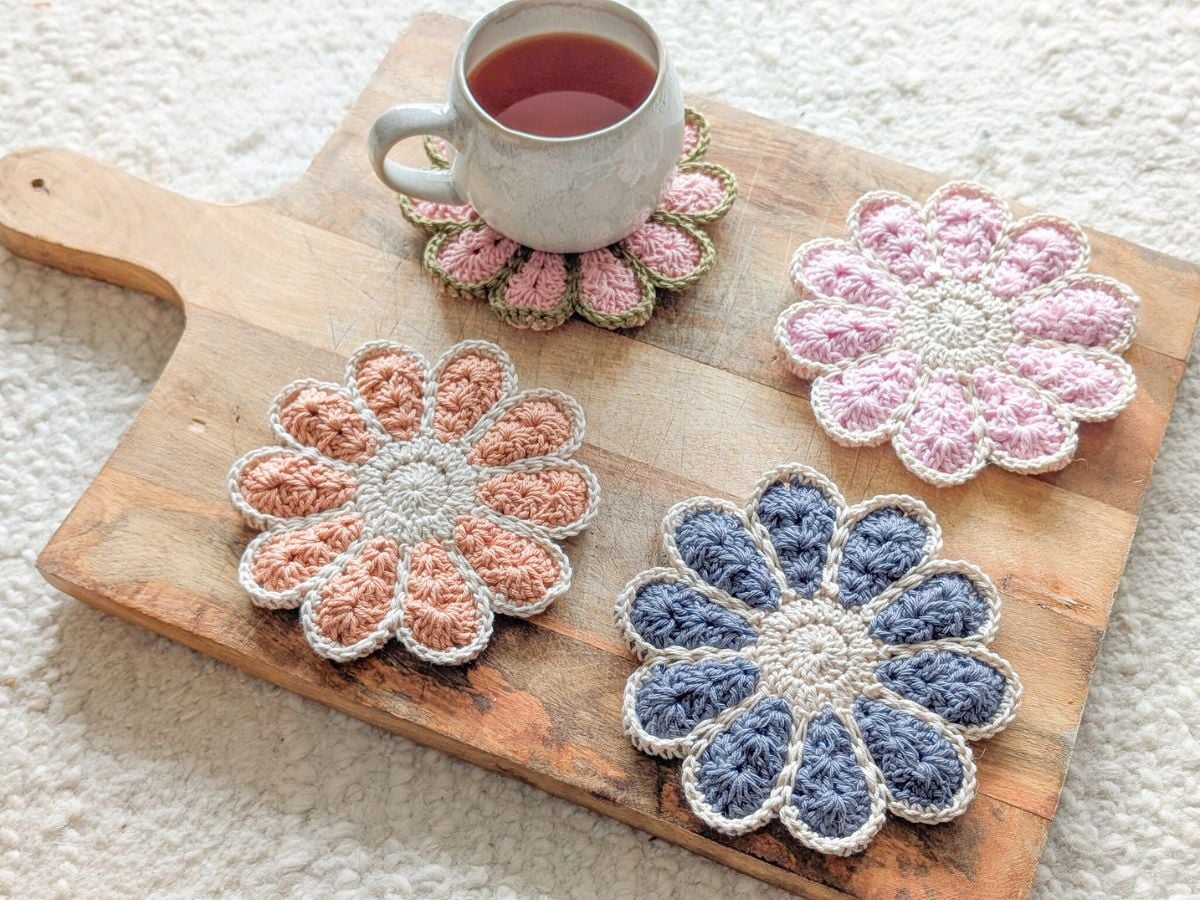 4 Crochet flower coasters in different colors