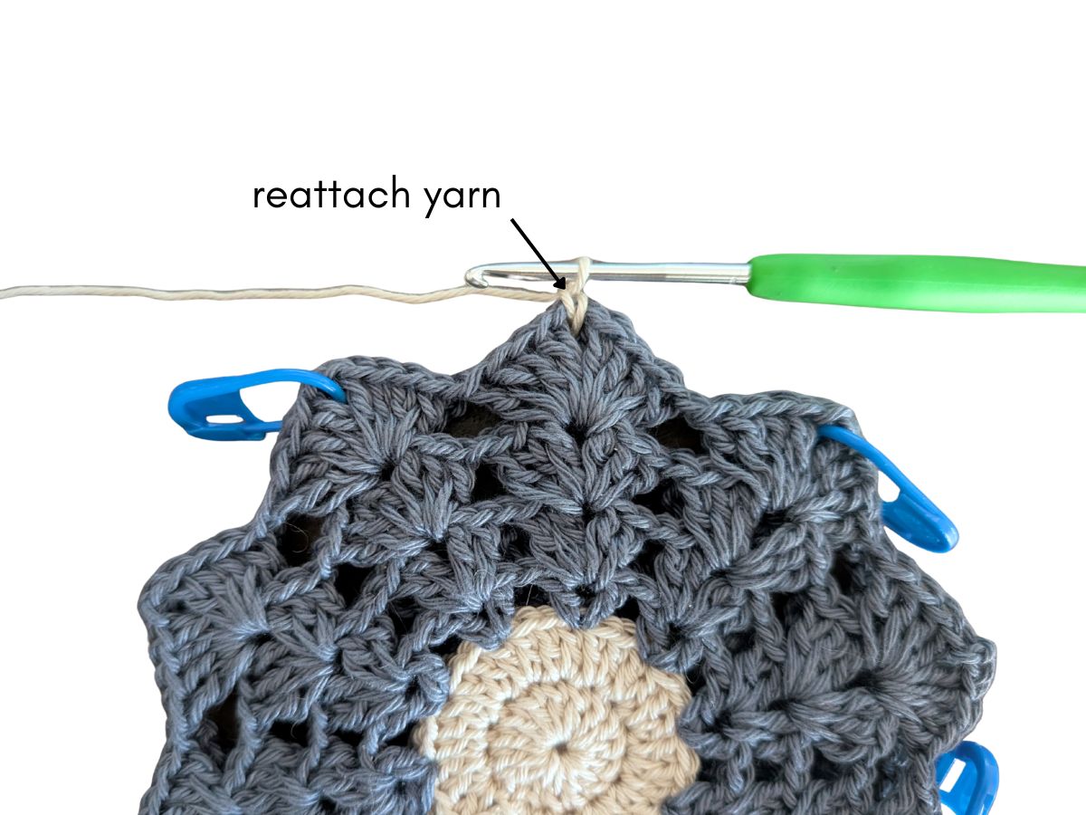 A new yarn is being added to the flower petal.