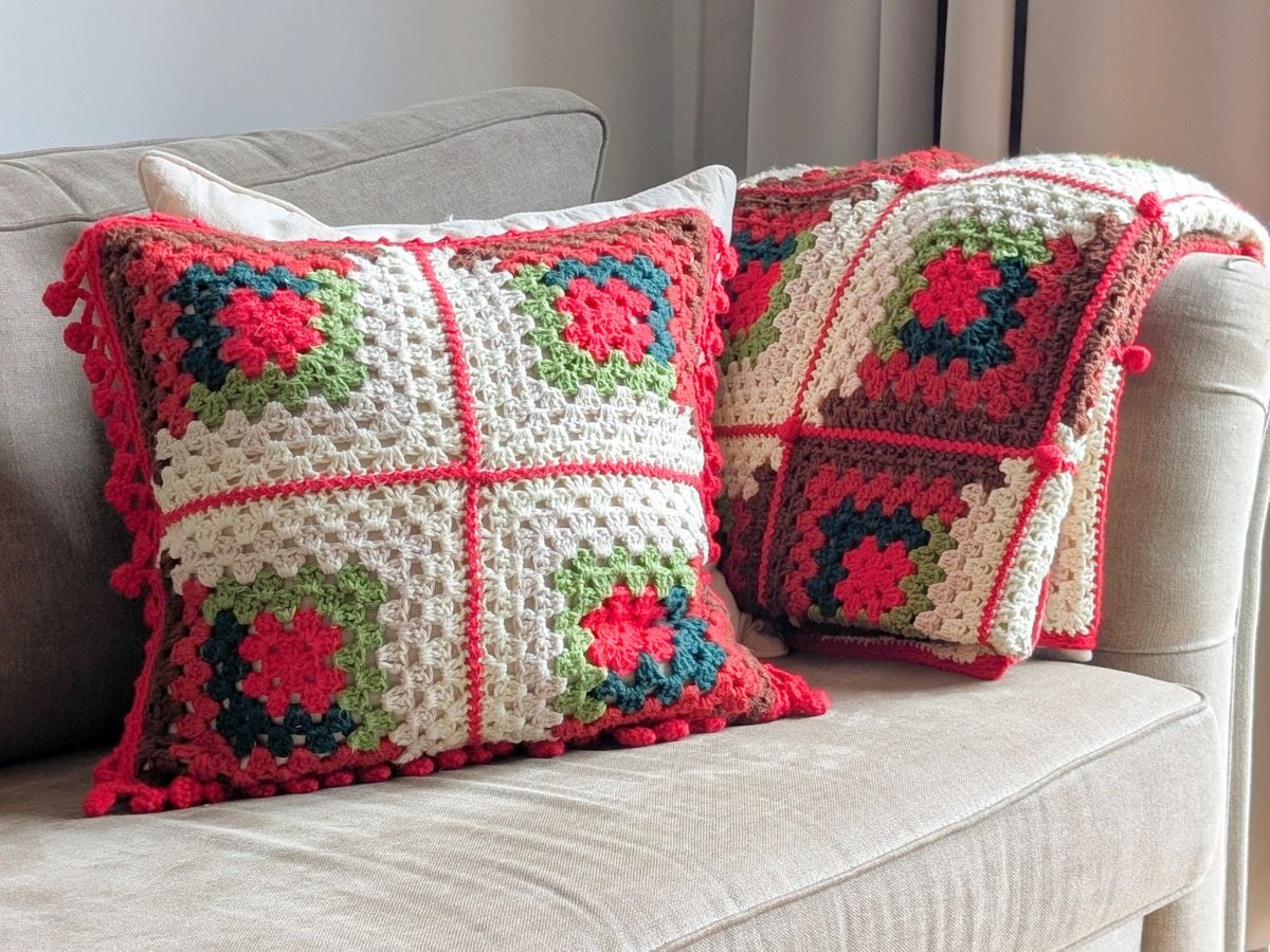 A matching crochet Christmas pillow + blanket set.